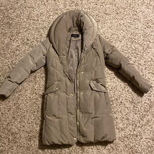 Crème full body coat with gold detailing